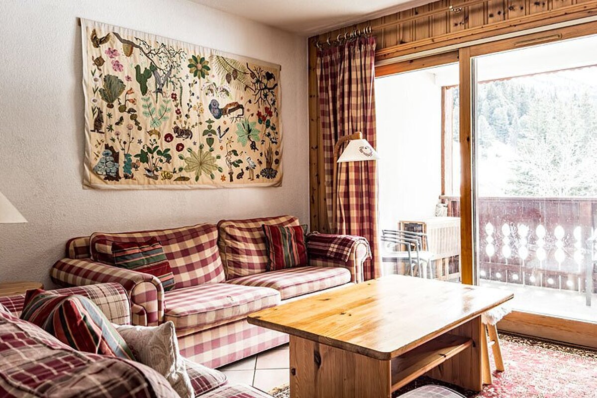 A living room with a couch and a coffee table