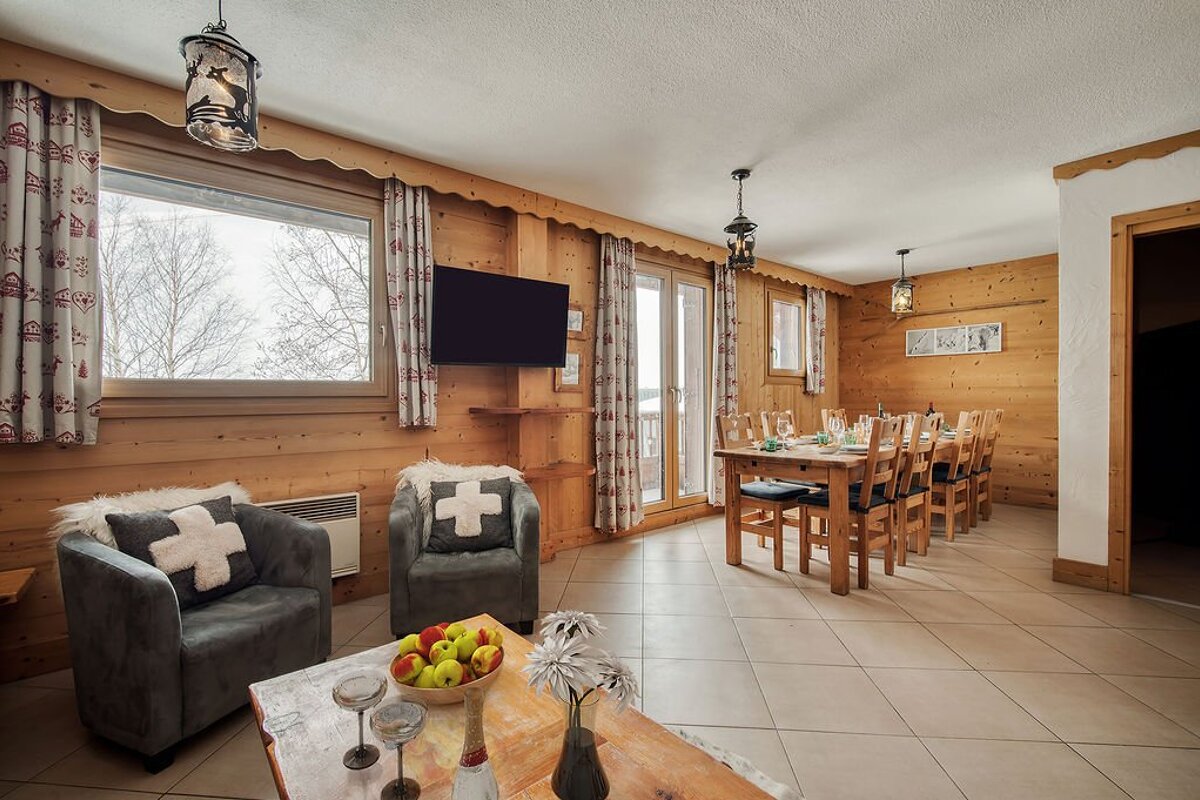 A living room with a chair with a cross on it