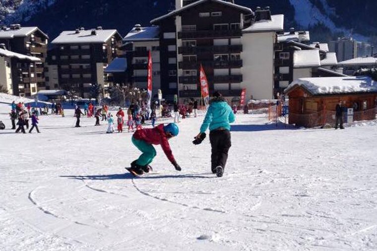 a snowboarder on a beginner slope