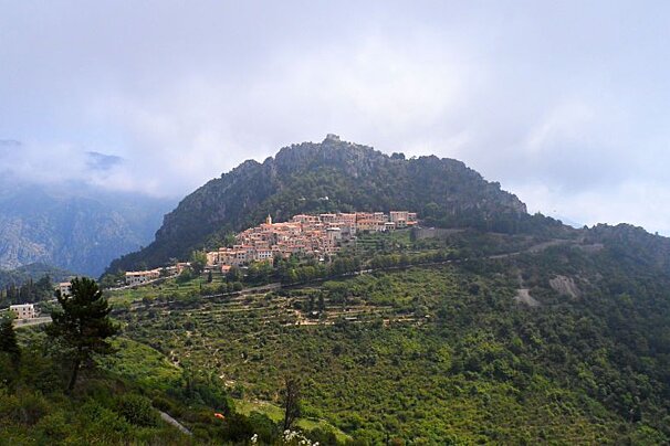 a hilltop top with green fields around it