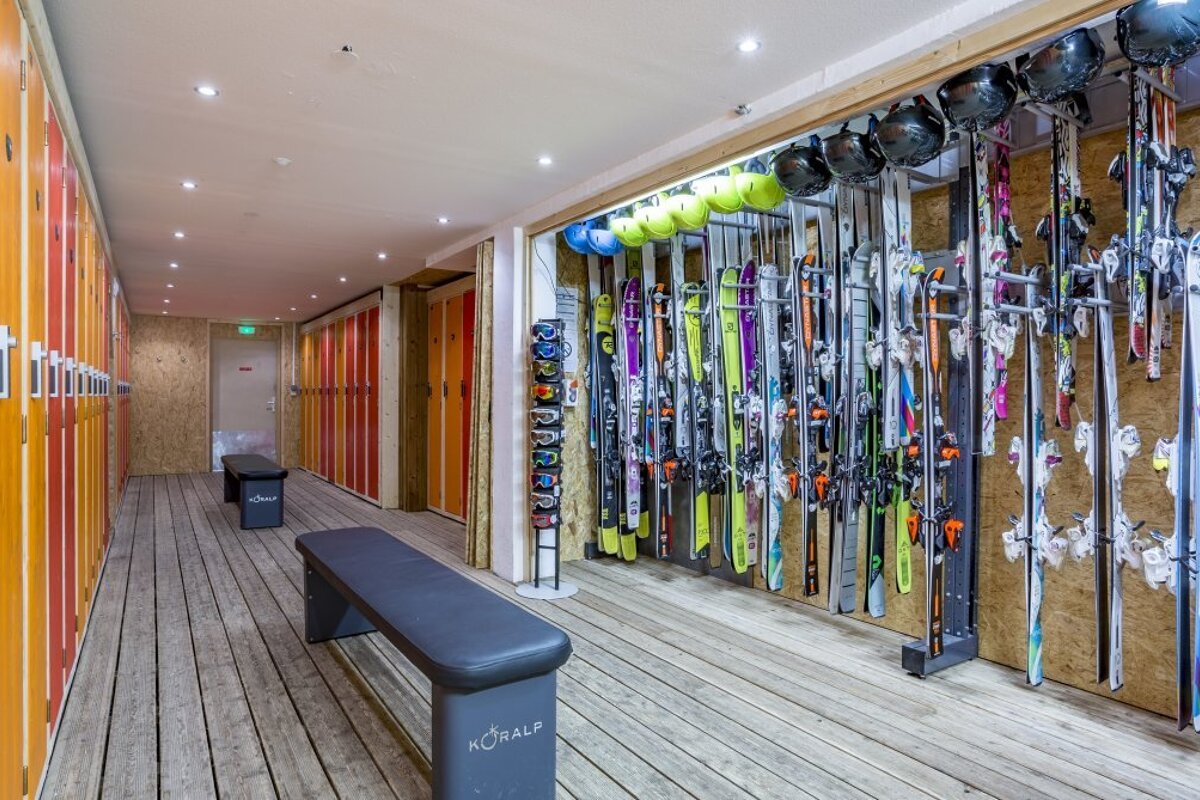 A locker room with a bench that says coral on it