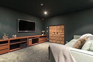 A living room with a couch and a flat screen tv