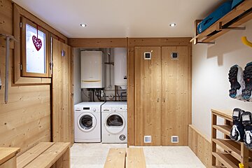 A laundry room with a washing machine and dryer