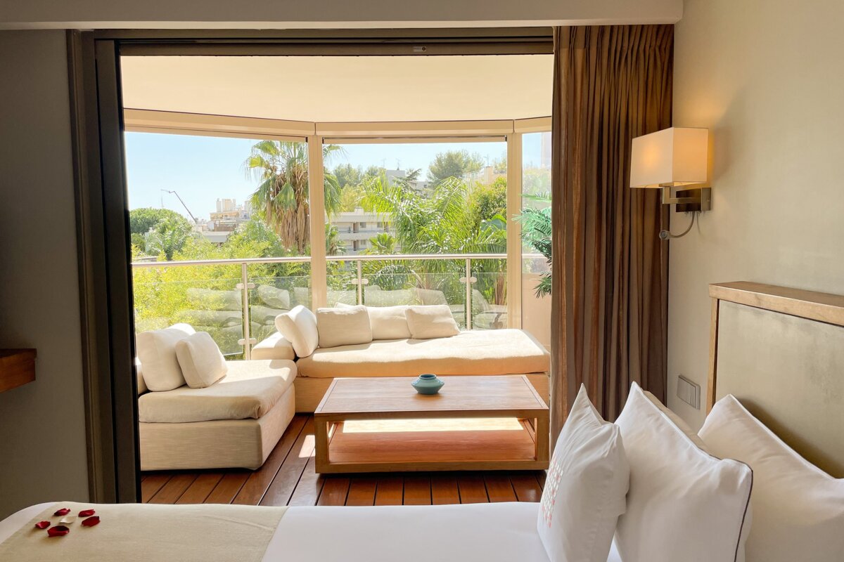A hotel room with a couch and a coffee table