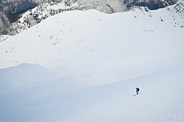 a tiny skier in courmayeur