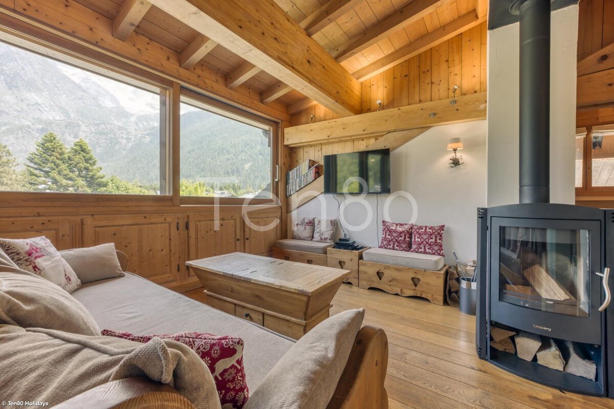 A living room with a couch and a fireplace and the word terroo on the wall