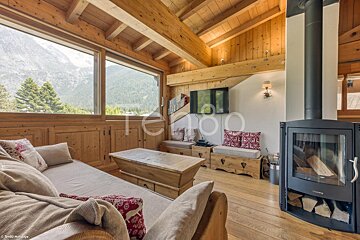 A living room with a couch and a fireplace and the word terroo on the wall