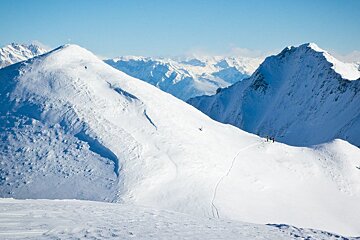 two skiers in the distance