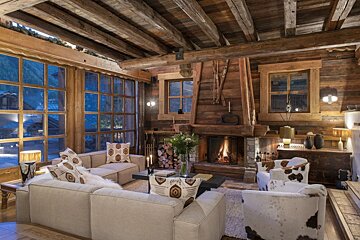 A living room filled with furniture and a fireplace