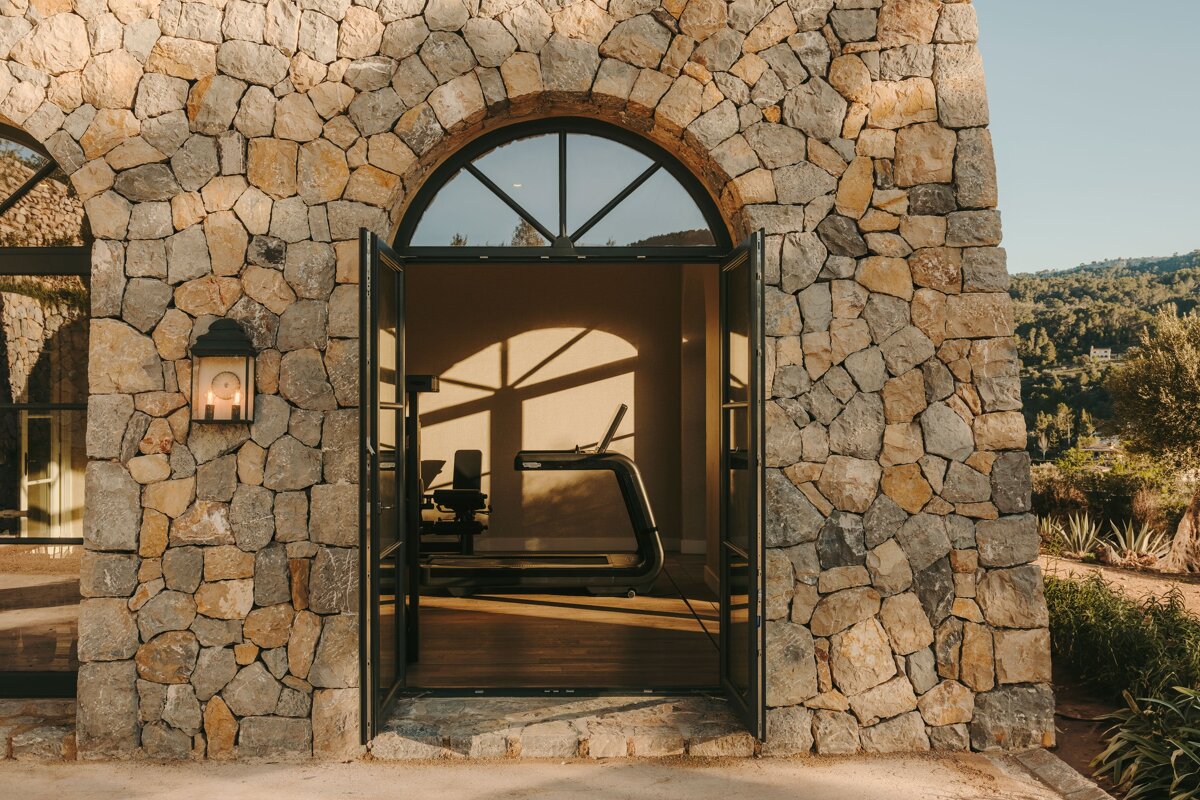 A stone building with a treadmill inside of it