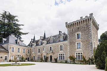 A large stone building with a tower on top of it