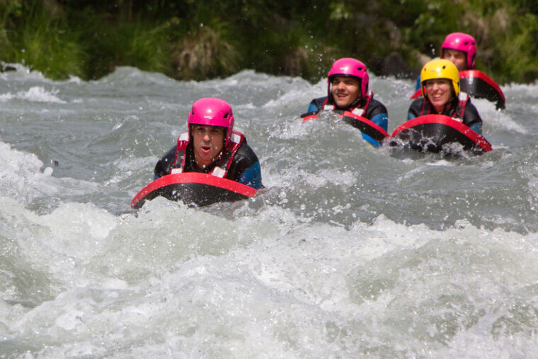 people hydrospeeding down a river