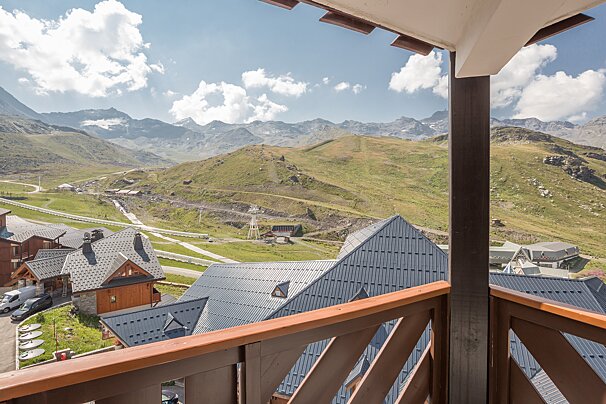 A view of a mountain range from a balcony