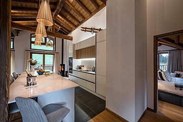 A kitchen with a bottle of champagne on the counter