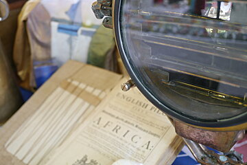 image of a book and magnifying glass