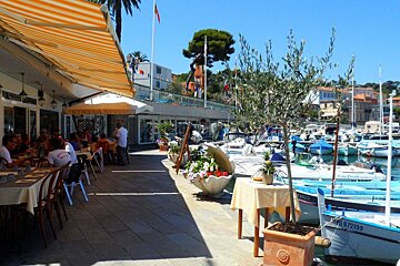 some boats tied up in a small port in Nice