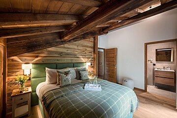 A bedroom with a bed and a tray on it