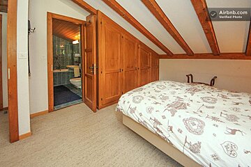 A bedroom with a bed and a sign that says airbnb.com