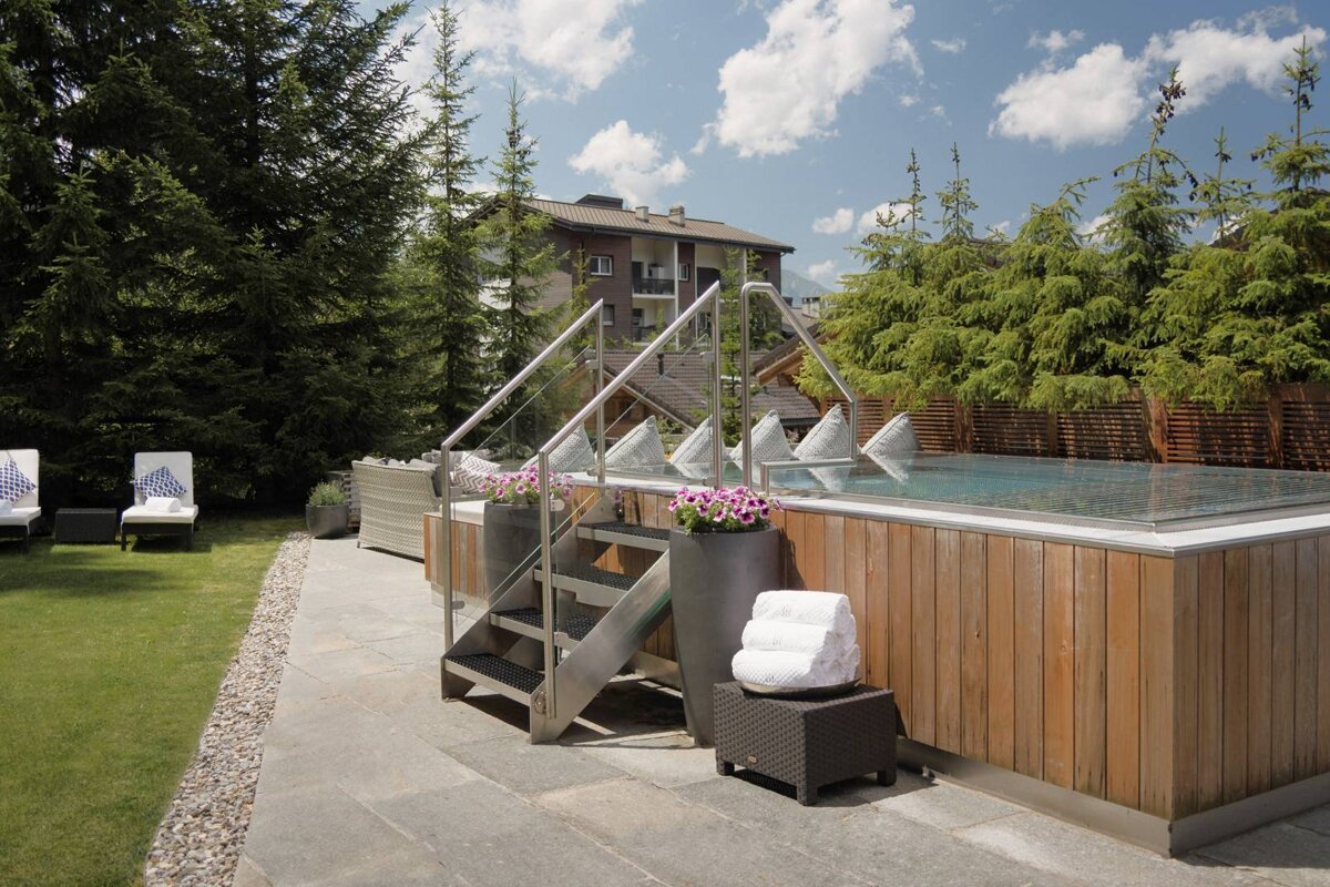 A swimming pool with stairs leading up to it
