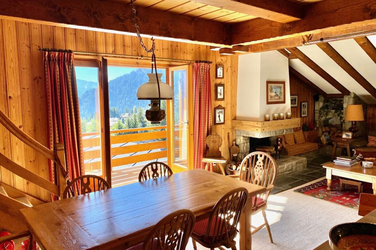 A wooden table and chairs in a living room