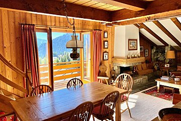 A wooden table and chairs in a living room