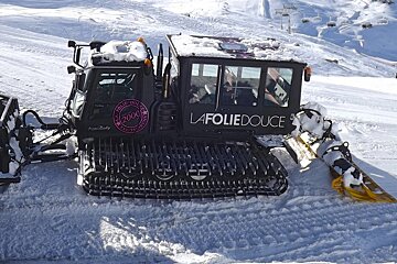a piste basher with La Folie Douce written on the side