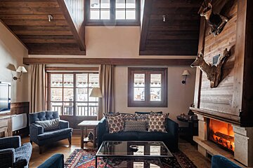 A living room with a fireplace and a couch
