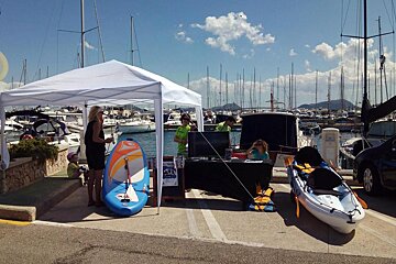 a stand at a yacht show in the marina