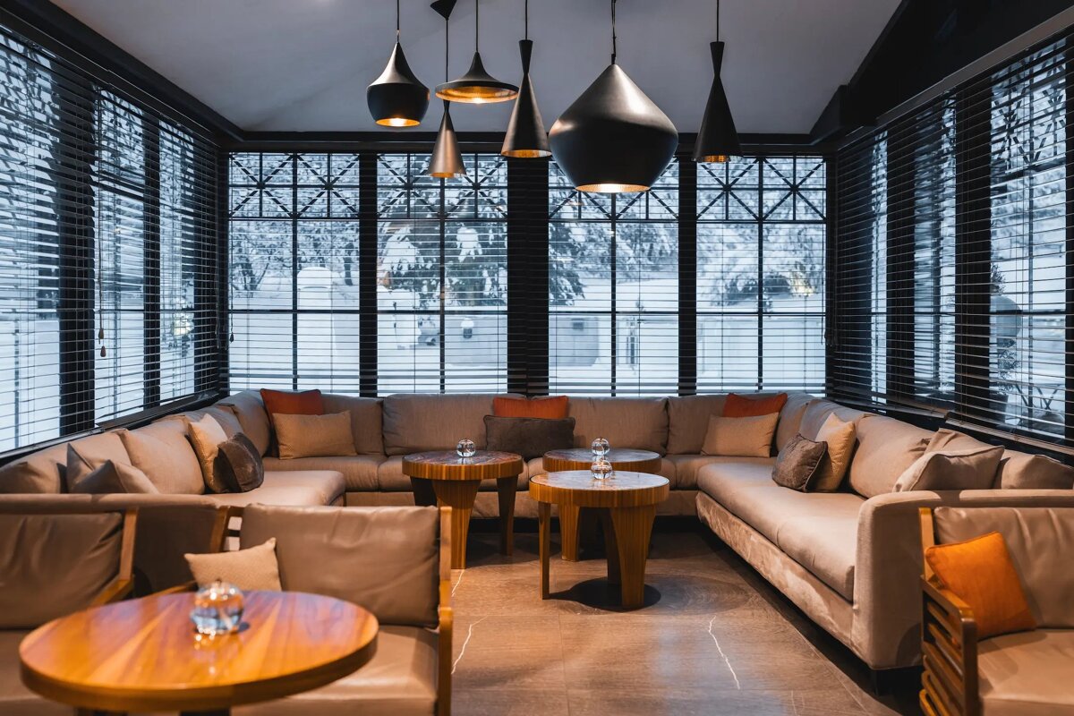 A living room with a lot of furniture and tables