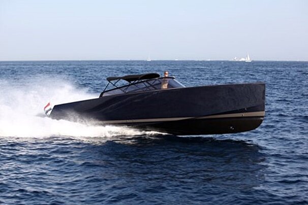 A boat in the ocean with a flag on the side
