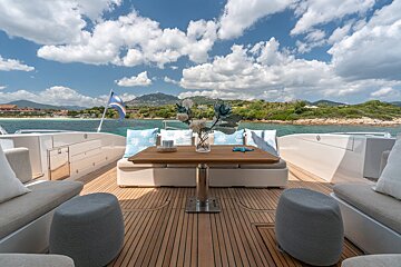 A boat with a table and a vase of flowers on it