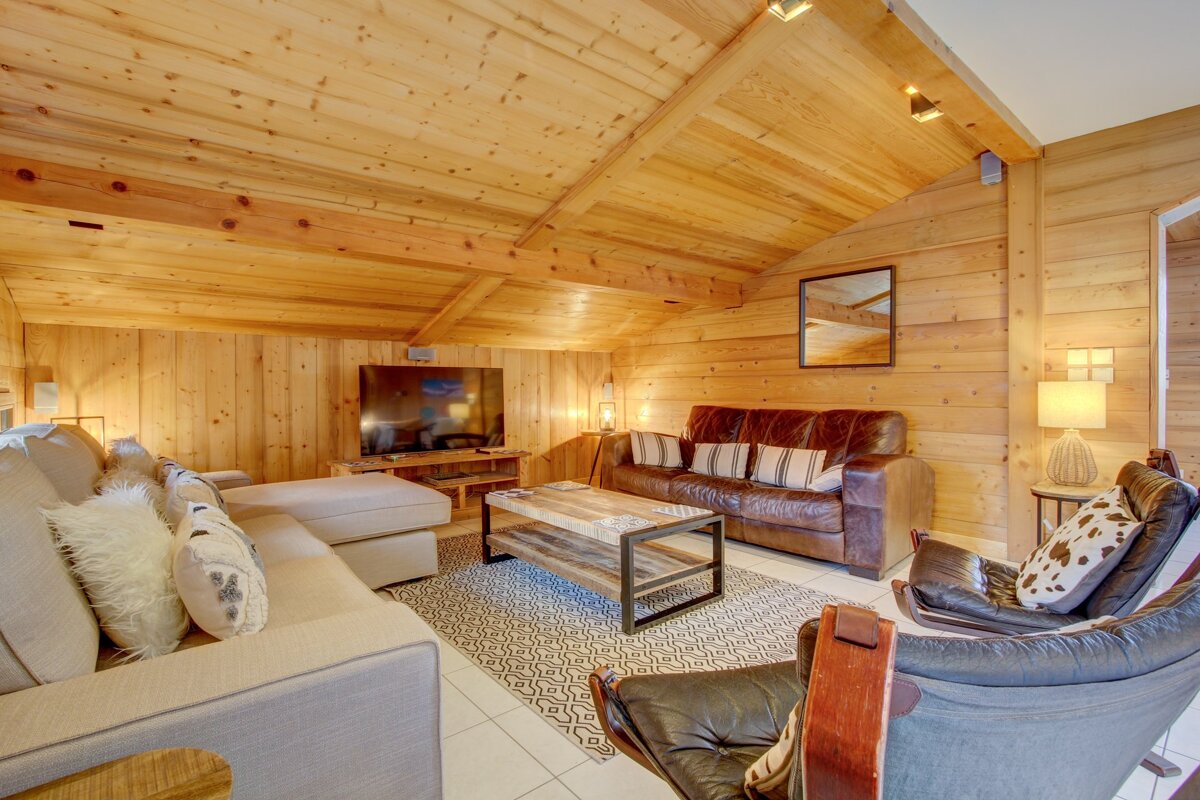 A living room filled with furniture and a flat screen tv