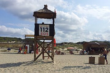 a lifeguard tower on a beach in mallorca