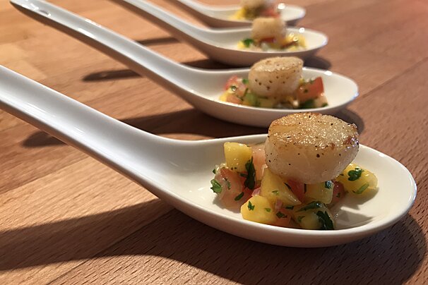 A close up of a spoon with food on it