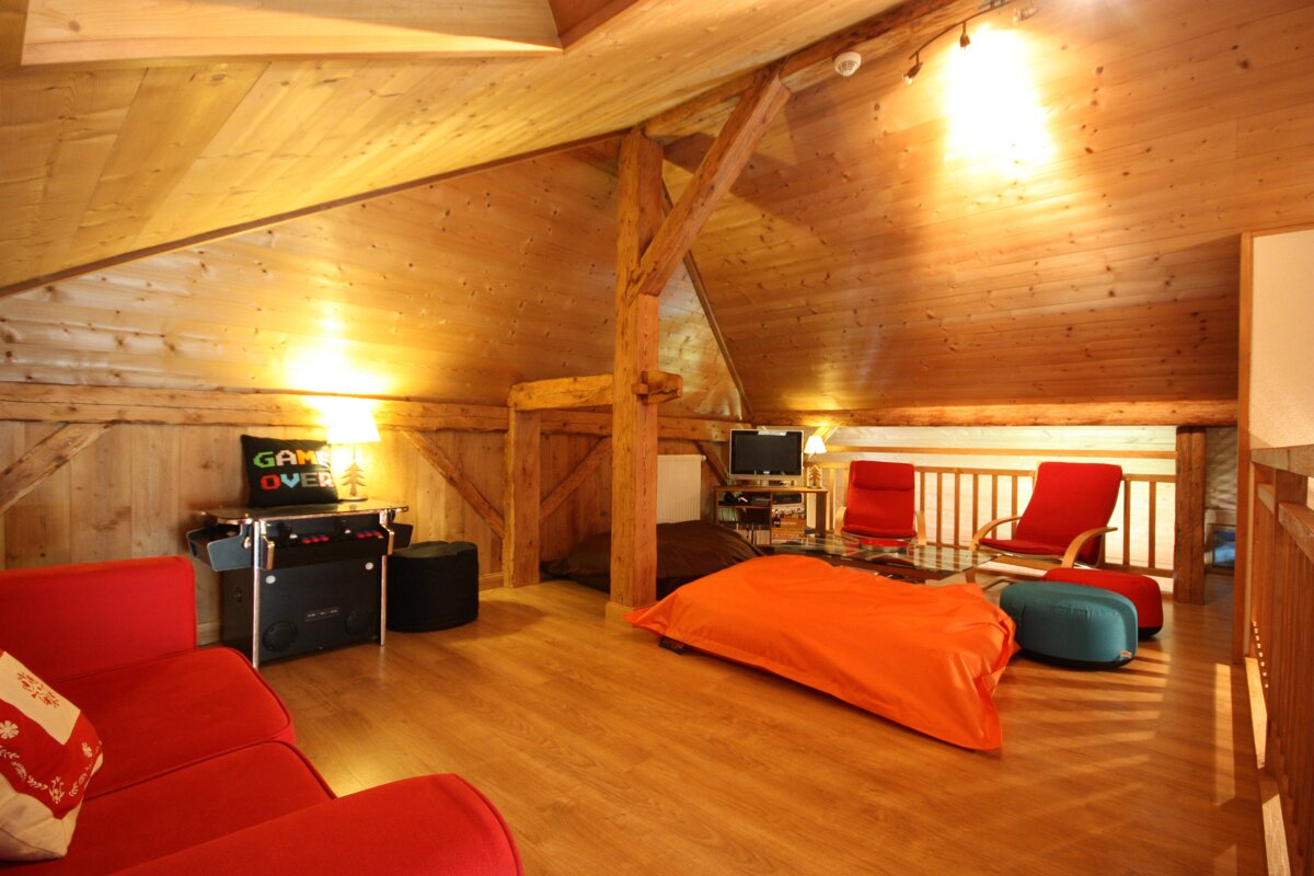 A living room with a game over sign on the wall