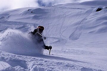 a skier in deep snow