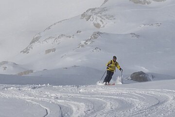 a skier with mist behind him