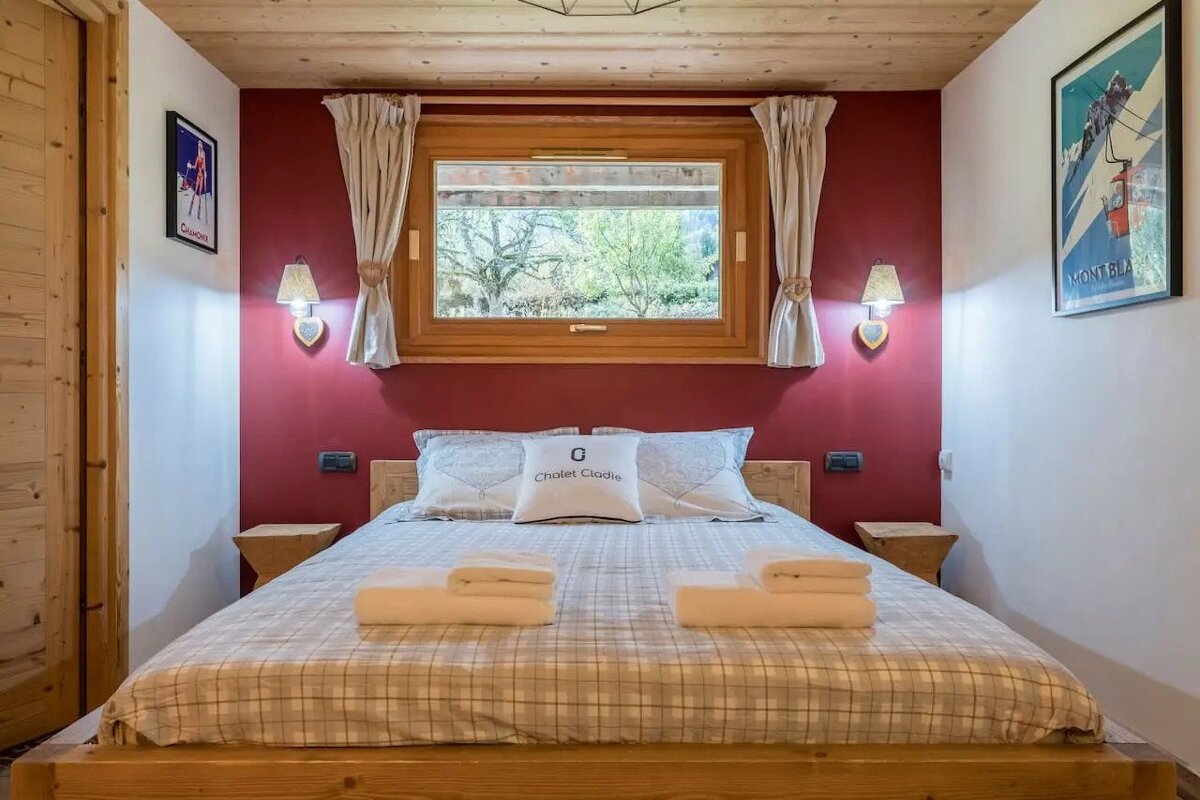 A bed with a pillow that says chalet emilia on it