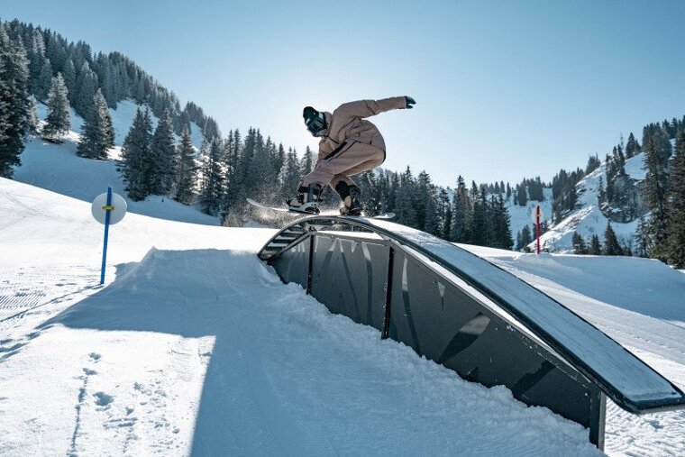 Boarder on a rail in Chatel snowpark