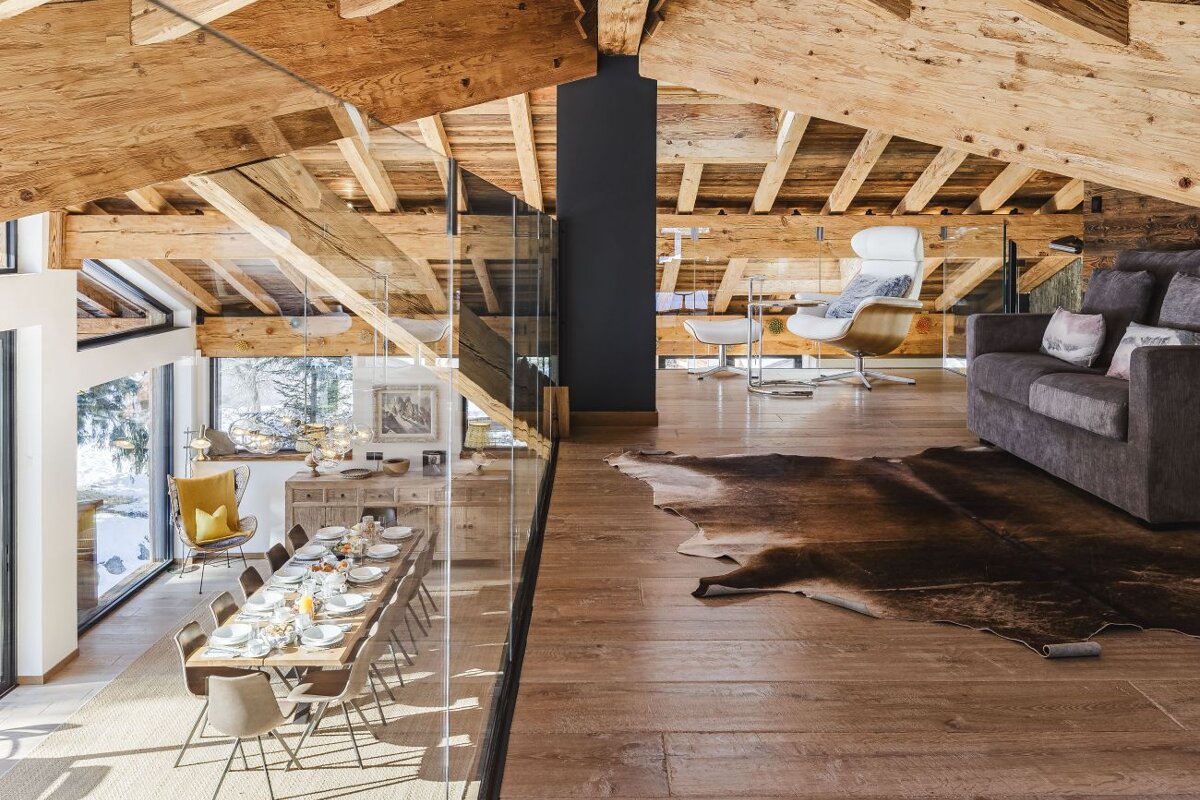 A living room with a couch and a table with plates on it