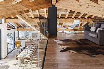 A living room with a couch and a table with plates on it