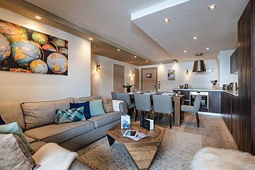 A living room with a couch and a table