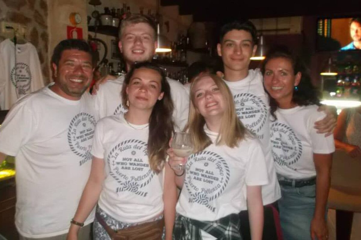 a group of people wearing a tapas tour tshirt