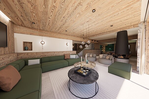 Cozy modern living room with wood ceilings, a long green sofa, round coffee tables, and a large black fireplace. Warm and inviting design.