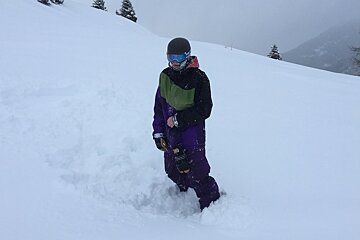 a snowboarder in the powder