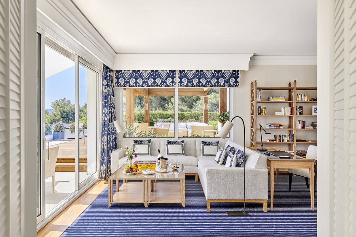 A living room with a couch and a bookshelf