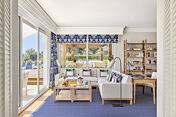 A living room with a couch and a bookshelf