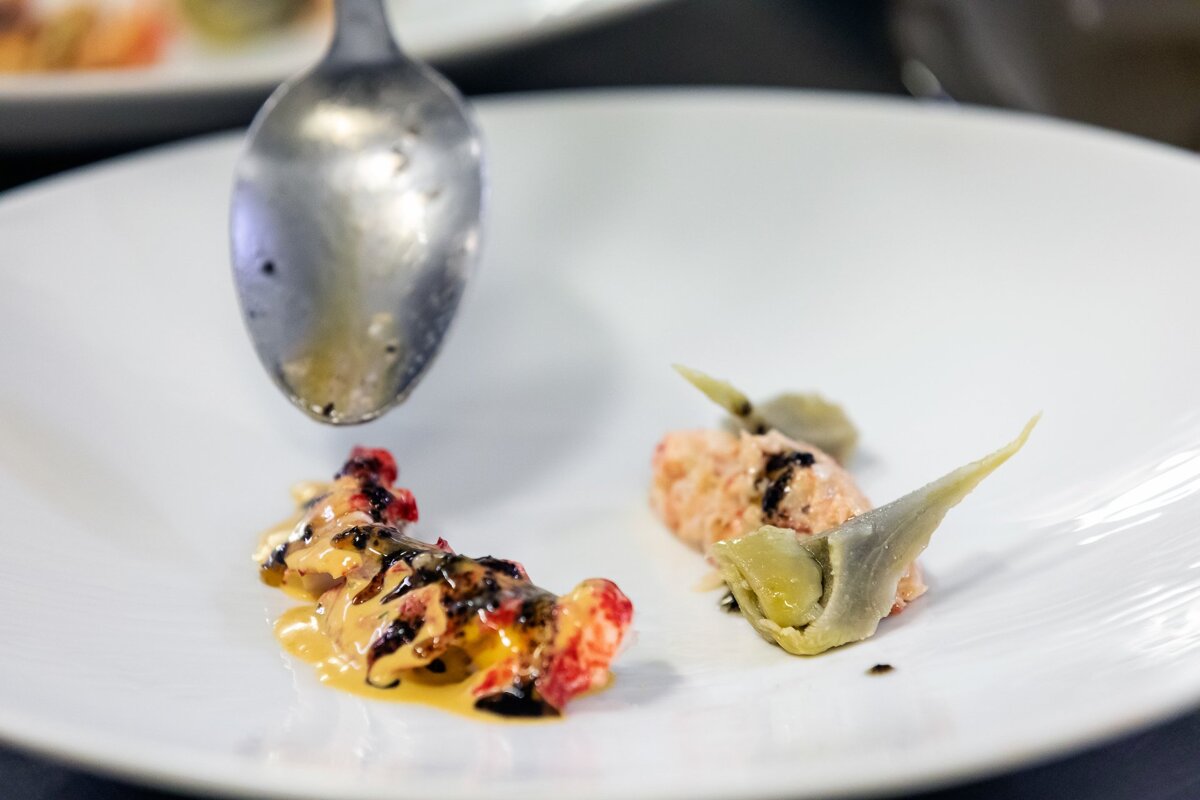 A plate of food with a spoon on it