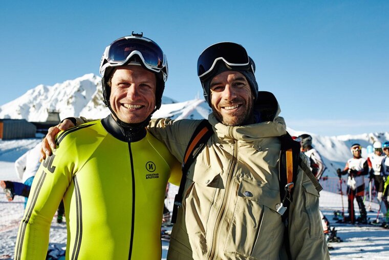 two skiers grinning at the camera