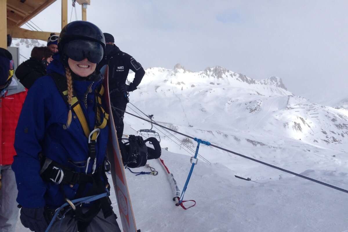 a woman nervously waiting to do a ski jump